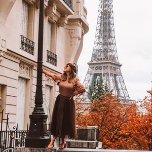 Skirt features a two-tone design with brown hue on top of mesh fabric